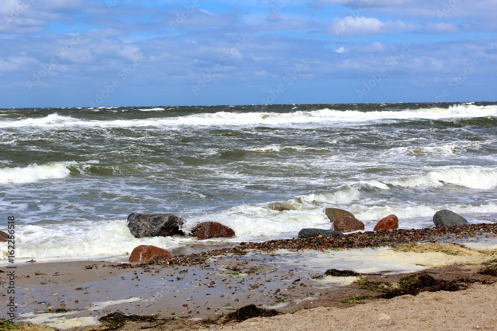 baltic sea beach in stormy weather with sea waves