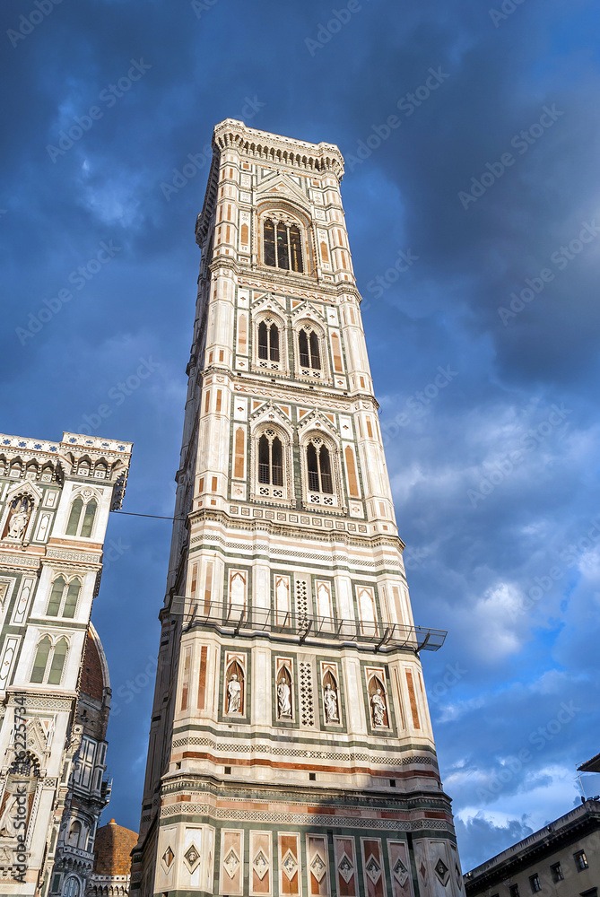 bottom view of the famous Campanile (tower bell) in a cloudy day in Florence, italy
