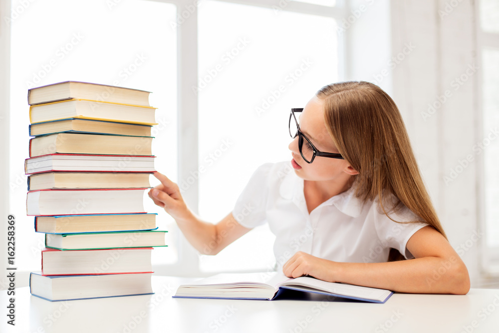student girl in glasses with books at school student girl in glasses with books at school