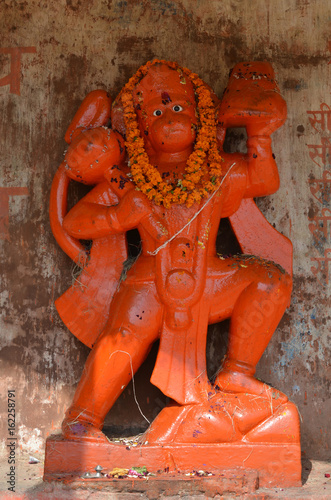 Orange Statue of Lord Hanuman, the Hindu Monkey Deity in Varanasi, India