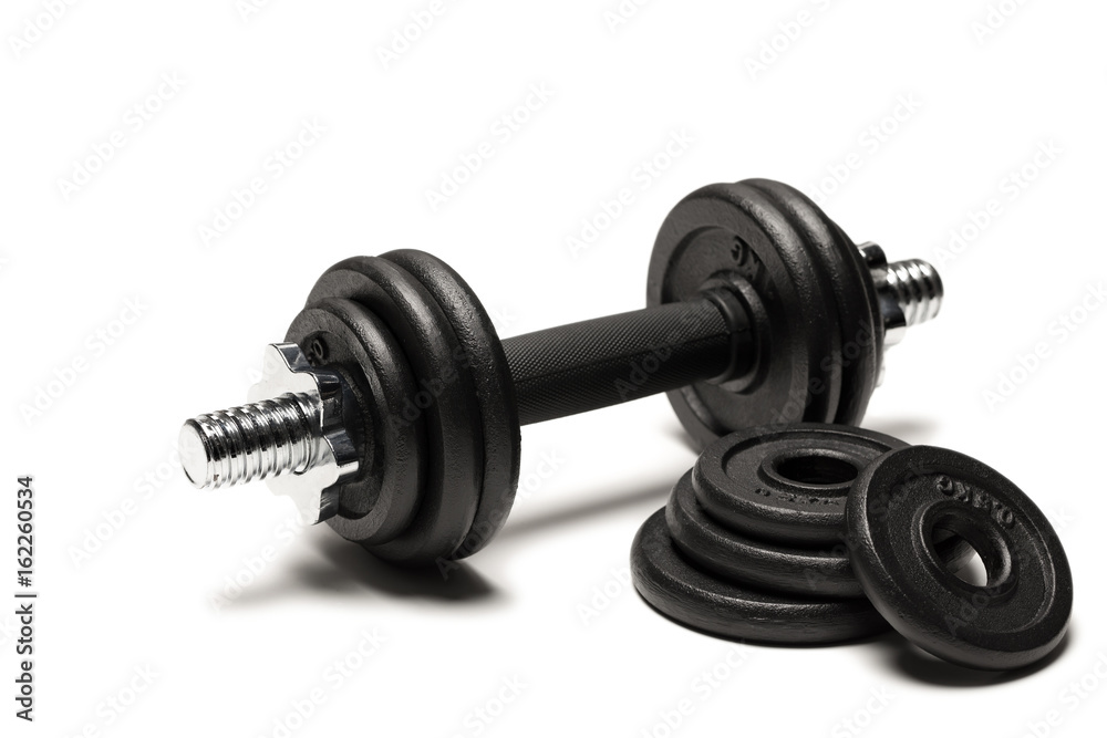 Fototapeta premium close up of iron dumbbell with weight plates isolated on white