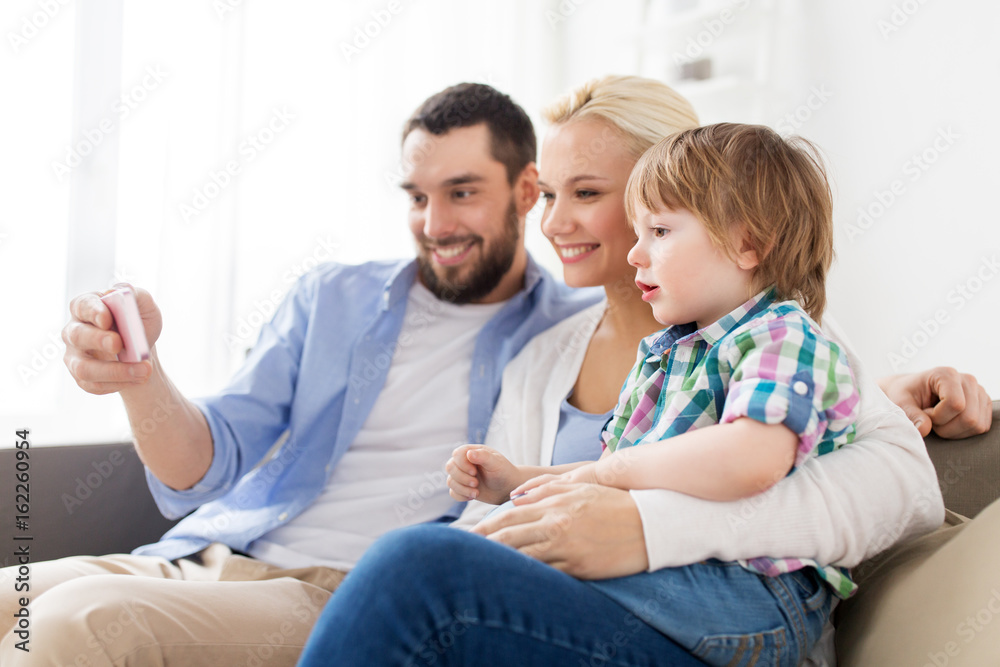 happy family with smartphone at home