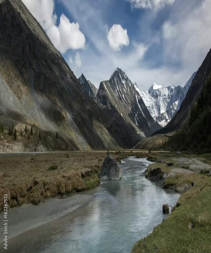 Timelapse of landscape with snow-covered mountains in Belukha, Altay, Russia