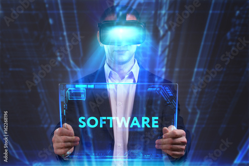 Business  Technology  Internet and network concept. Young businessman working in virtual reality glasses sees the inscription  Software