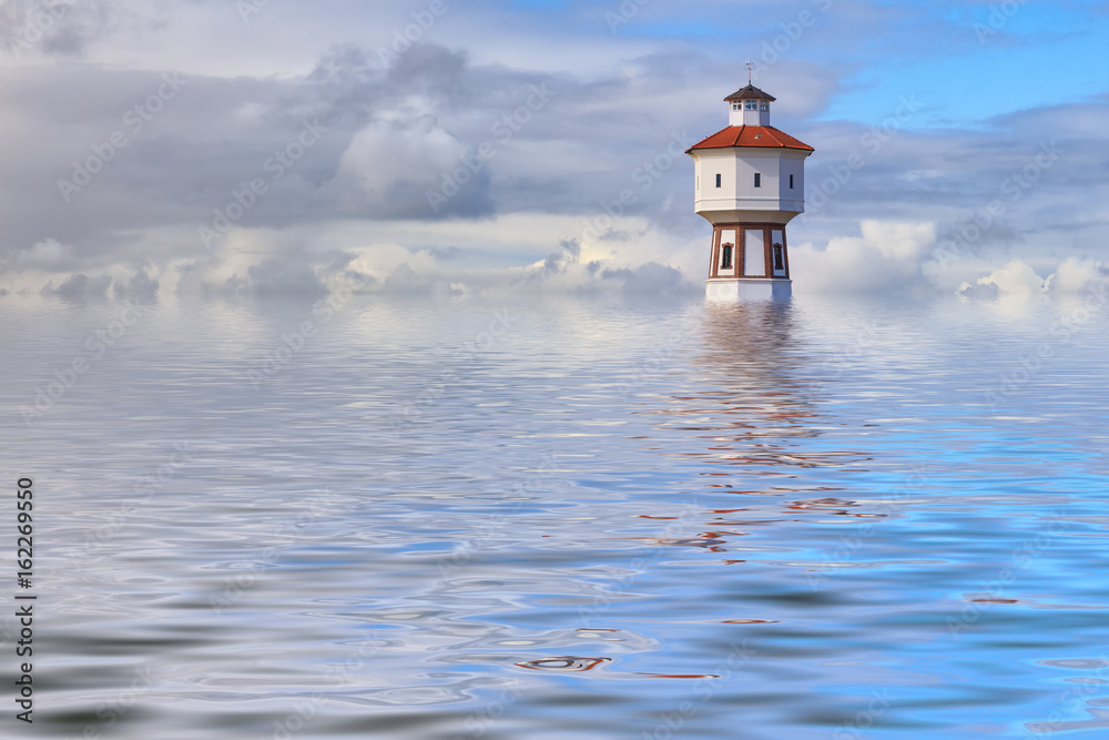 Flood simulation. Lighthouse and water tower at the island of Langeoog, Lower Saxony, Germany