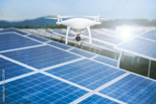 Drone with camera fly over Solar panels ; Photovoltaic systems .