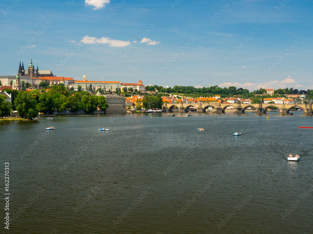 Obraz premium Prague, Chezh republic, 2017. The Vltava River flows through the centre of Prague, and is the waterway around which the city has developed over the past 1000 years.