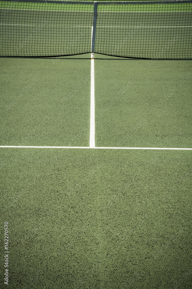 Centre of all weather tennis court in bright sunshine
Centre of all weather tennis court in bright sunshine