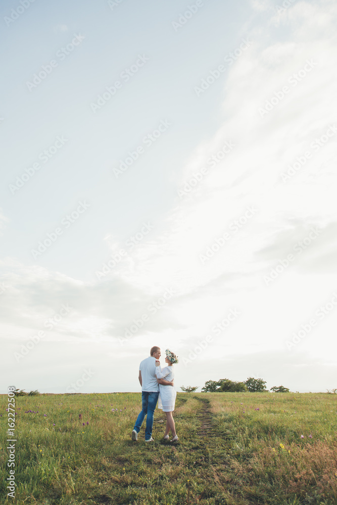 beautiful pregnant girl and her husband in the nature beautiful pregnant girl and her husband in the nature