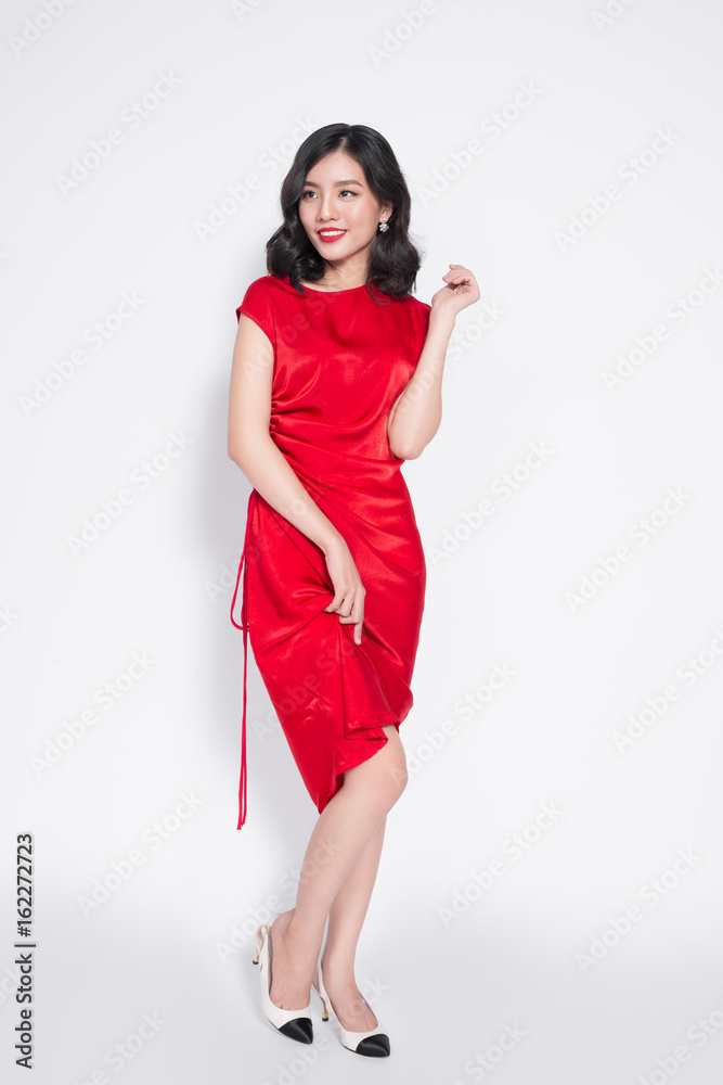 Full length of amazing luxury asian woman in stylish red party dress Full length of amazing luxury asian woman in stylish red party dress