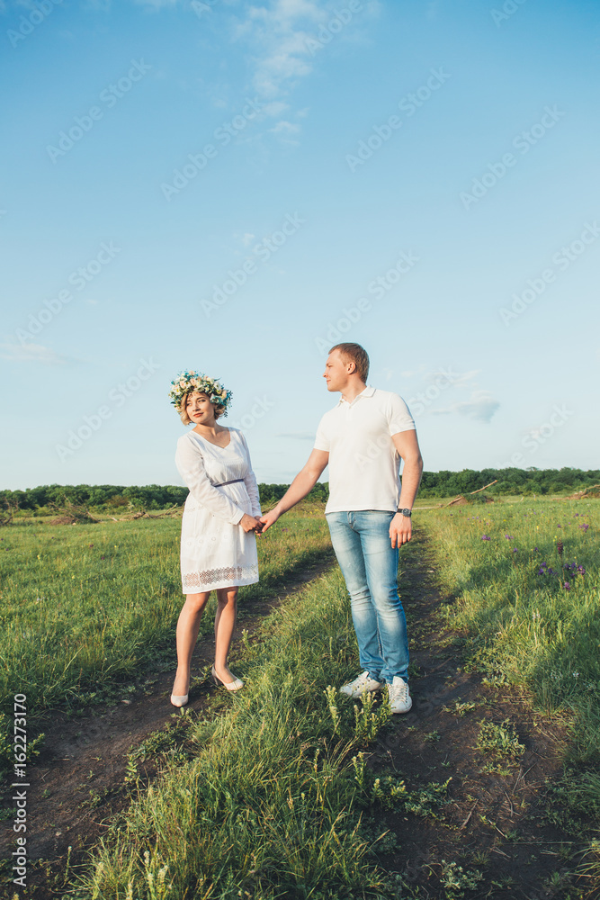 beautiful pregnant girl and her husband in the nature beautiful pregnant girl and her husband in the nature