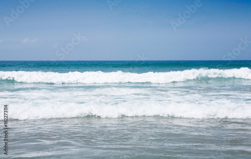Waves splashing on the beach © goir