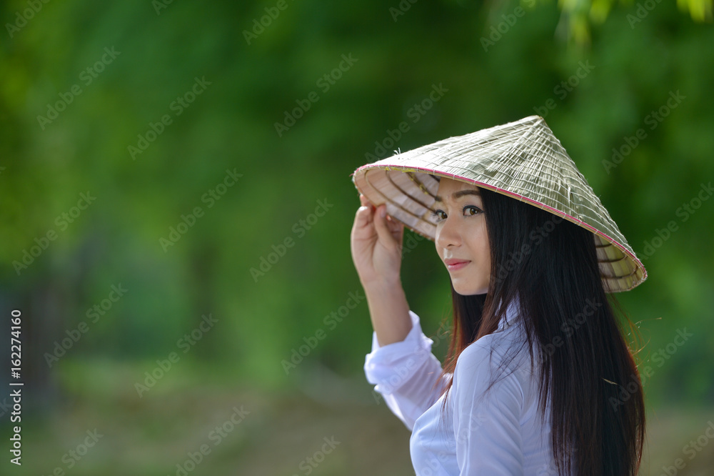 Beautiful  woman with Vietnam culture traditional dress,traditional costume ,vintage style,Vietnam