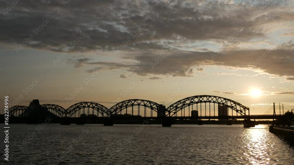 Time lapse from the Railway Bridge during sunset in Riga, Latvia Time lapse from the Railway Bridge during sunset in Riga, Latvia