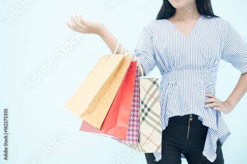 Hand of woman resting for shopping with colorful bag, isolated on white background with parth.