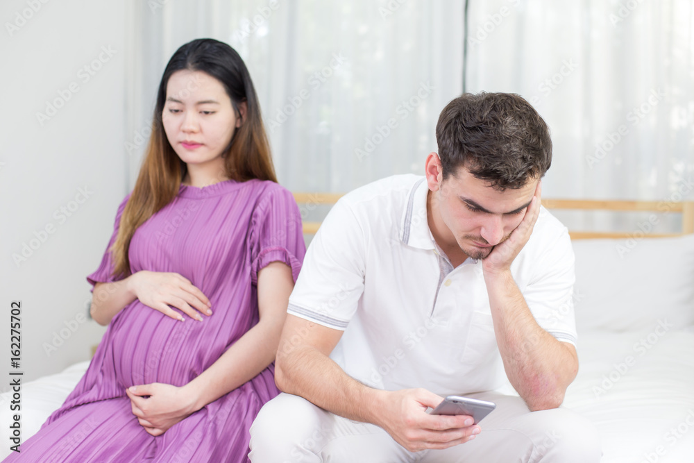 Upset of couple finding out results of a pregnancy, family concept, unhappy emotion.