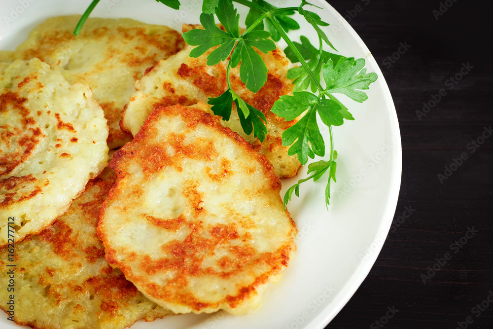 Draniki on a plate. Traditional Ukrainian and Russian cuisine. Draniki on a plate. Traditional Ukrainian and Russian cuisine.