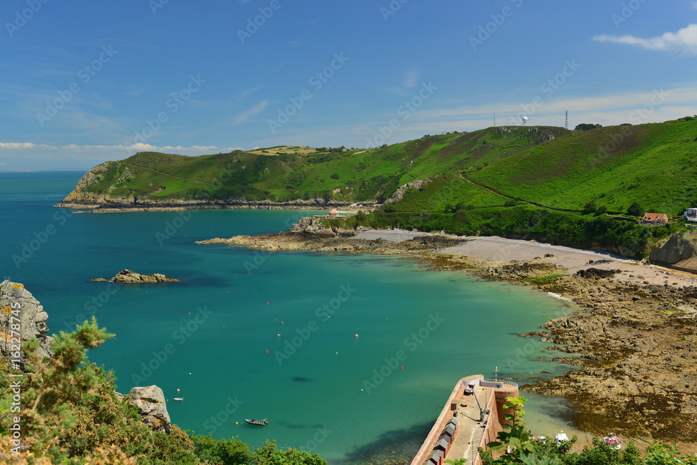 Bonne Nuit Harbour, Jersey, U.K.  Wide angle high viewpoint vista of an idyllic bay in the Summer.