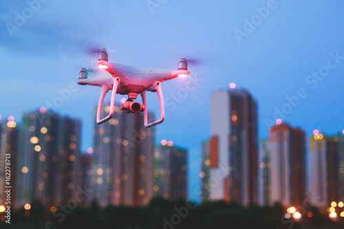 A process of launching the quadcopter drone with camera, operator launches quadcopter uav, unmanned aerial vehicle flying   © tsuguliev