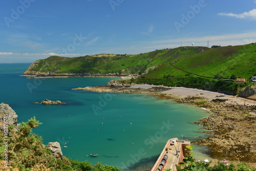Bonne Nuit Harbour, Jersey, U.K. Wide angle high viewpoint vista of an idyllic bay in the Summer.