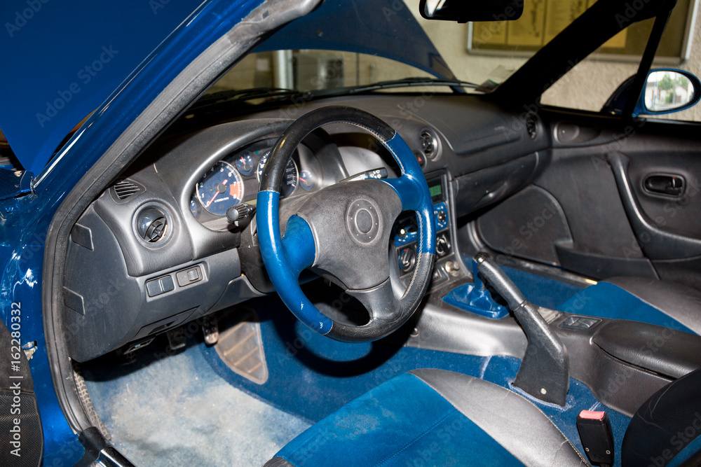 Leather interior and blue alcantara of a sports car