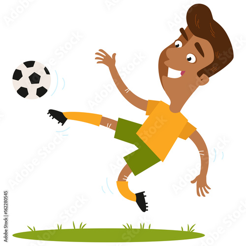 Smiling south american cartoon footballer wearing yellow shirt and green shorts kicking the ball in mid-air isolated on white background.