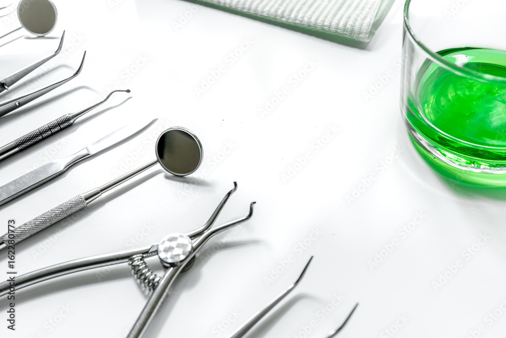 dentist desk with instruments on white background dentist desk with instruments on white background