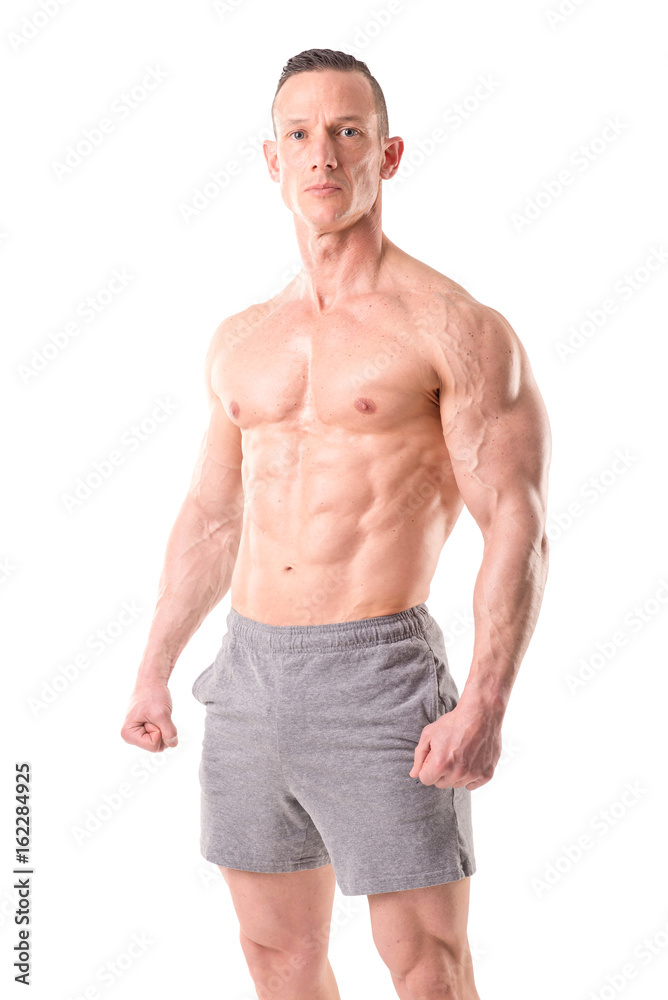 fit muscular man posing isolated in white fit muscular man posing isolated in white
