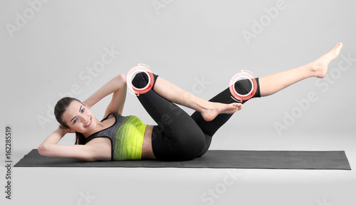 Young woman doing bicycle c...