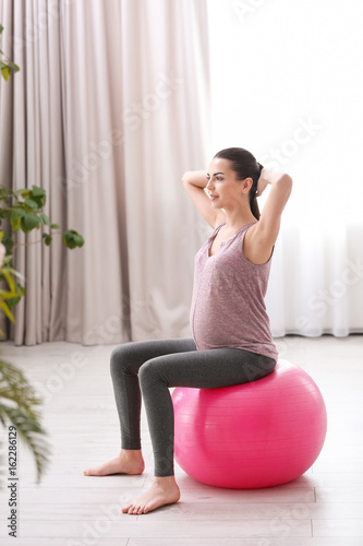 Beautiful pregnant woman do...