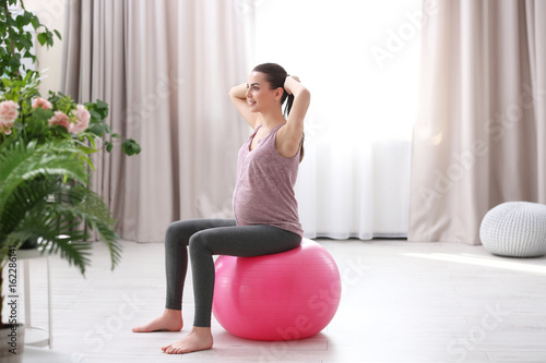 Beautiful pregnant woman do...