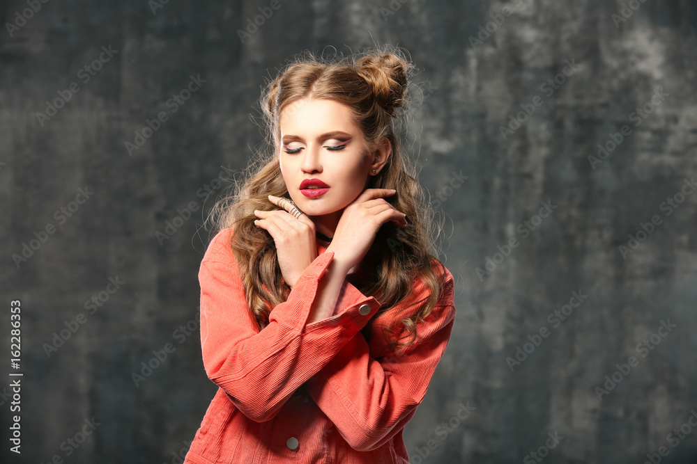 Beautiful stylish woman on grey background Beautiful stylish woman on grey background