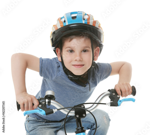 Cute little boy riding bicy...