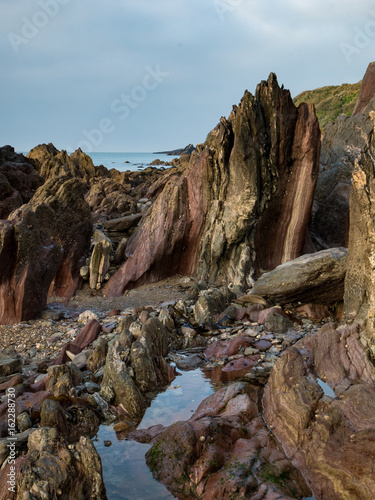 Variegated rocks at the water's edge