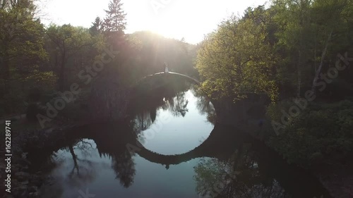 Rainbow over Devil's bridge in the park Kromlau, Germany, wedding photo