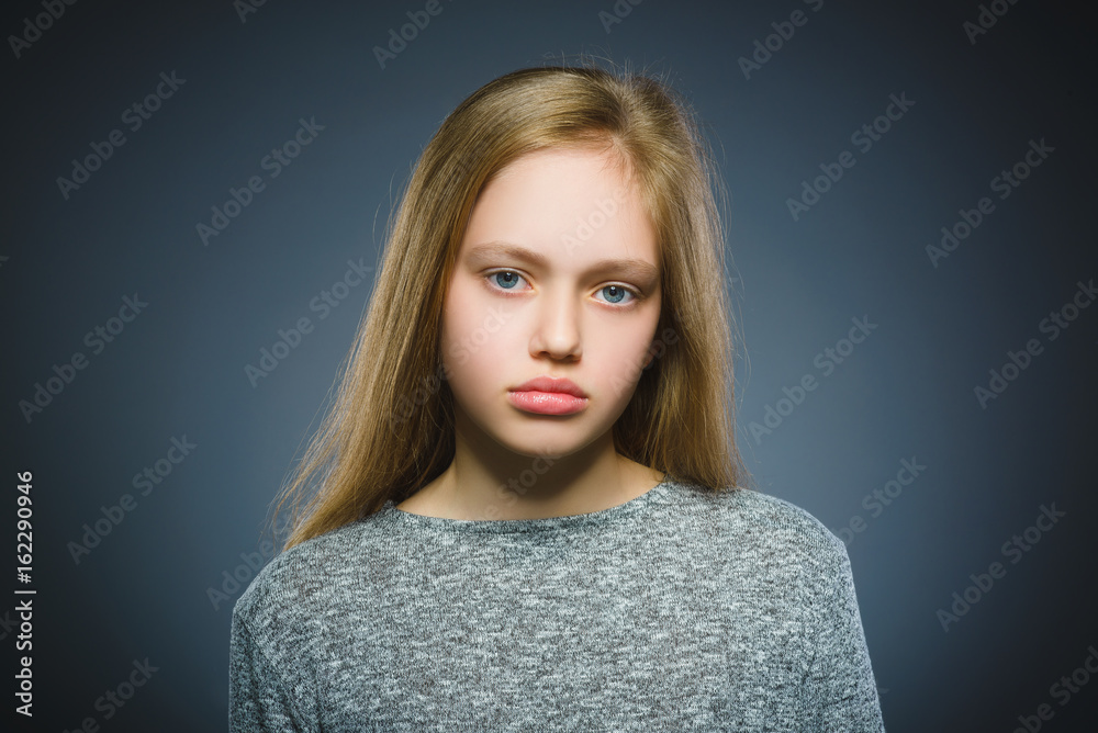 Closeup sad girl with worried stressed face expression Closeup sad girl with worried stressed face expression