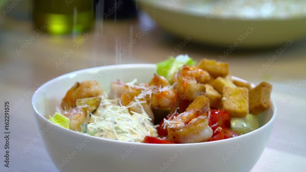 Fresh slalad with shrimp on the wooden table closeup Fresh slalad with shrimp on the wooden table closeup