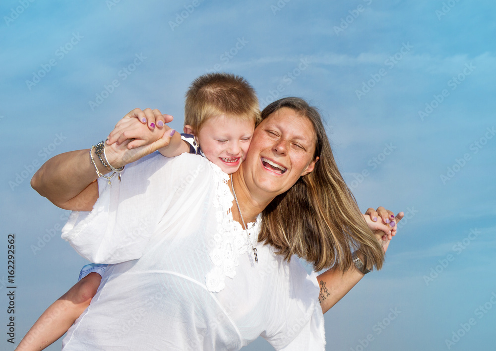 Mom and son are playing happy smiling Mom and son are playing happy smiling