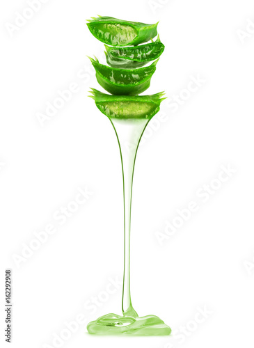 Transparent essence from aloe vera plant drips from leaves on white background