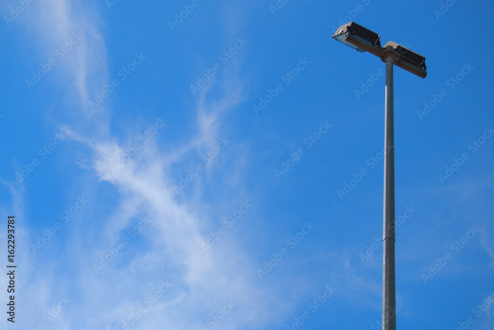 A lantern against the blue sky.