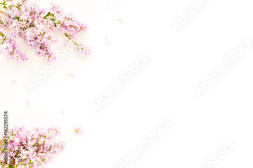 Flowers background. Lilac flowers on white background. Top view  flat lay  copy space