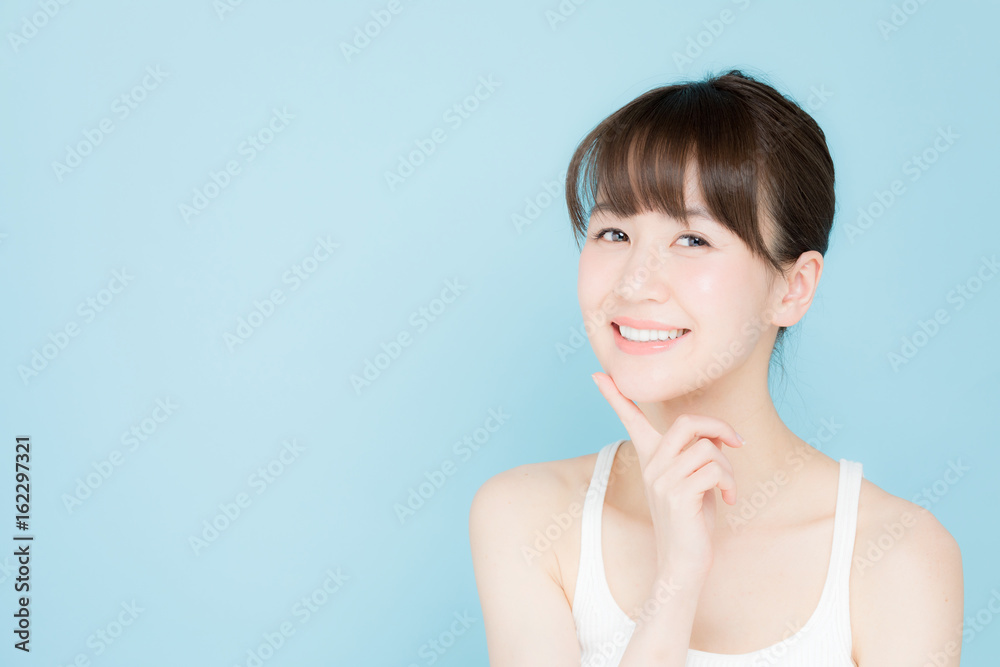 attractive asian woman beauty image on blue background attractive asian woman beauty image on blue background