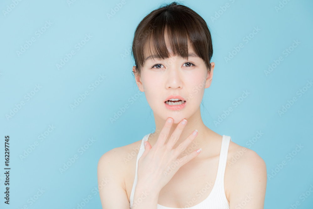 attractive asian woman beauty image on blue background attractive asian woman beauty image on blue background