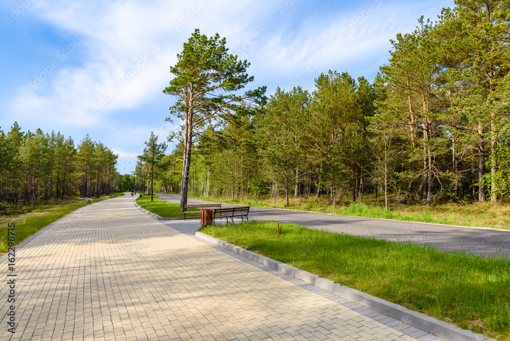 Promenade leading to the sandy beach and Baltic Sea in Bialogora village in Poland.
