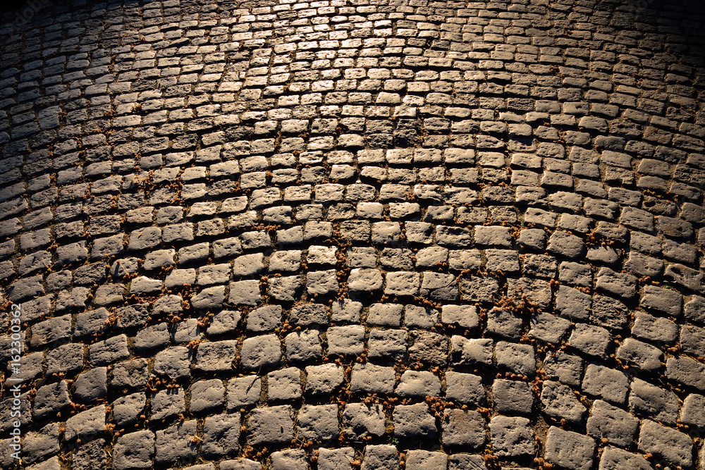 Gloomy old cobblestone pavement