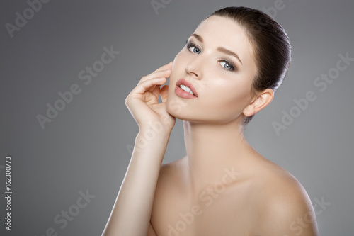 beautiful face of woman with blue eyes and clean fresh skin. Spa portrait