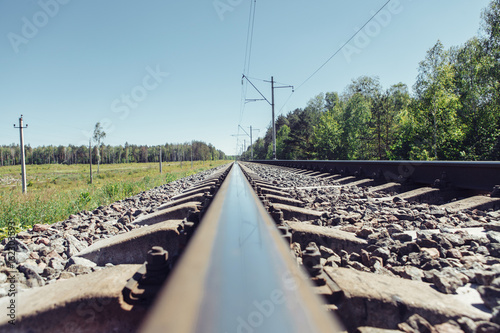 Railway track to the up country. Railway rail close-up, background, wallpaper.