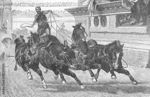 Ancient Roman charioteer driving four horses. Date: BCE photo