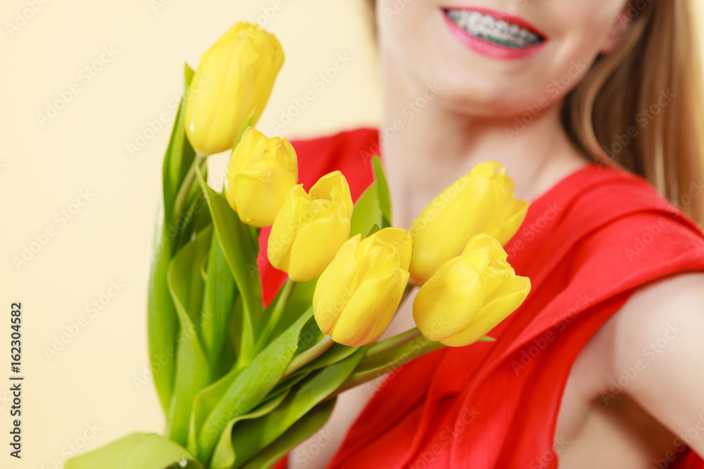 Pretty woman with yellow tulips bunch Pretty woman with yellow tulips bunch
