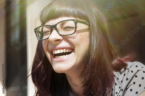 Young woman laughing with joy, Osijek, Croatia photo